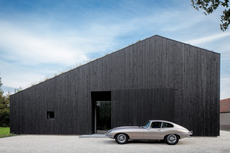 Contemporary barn with gravel driveway